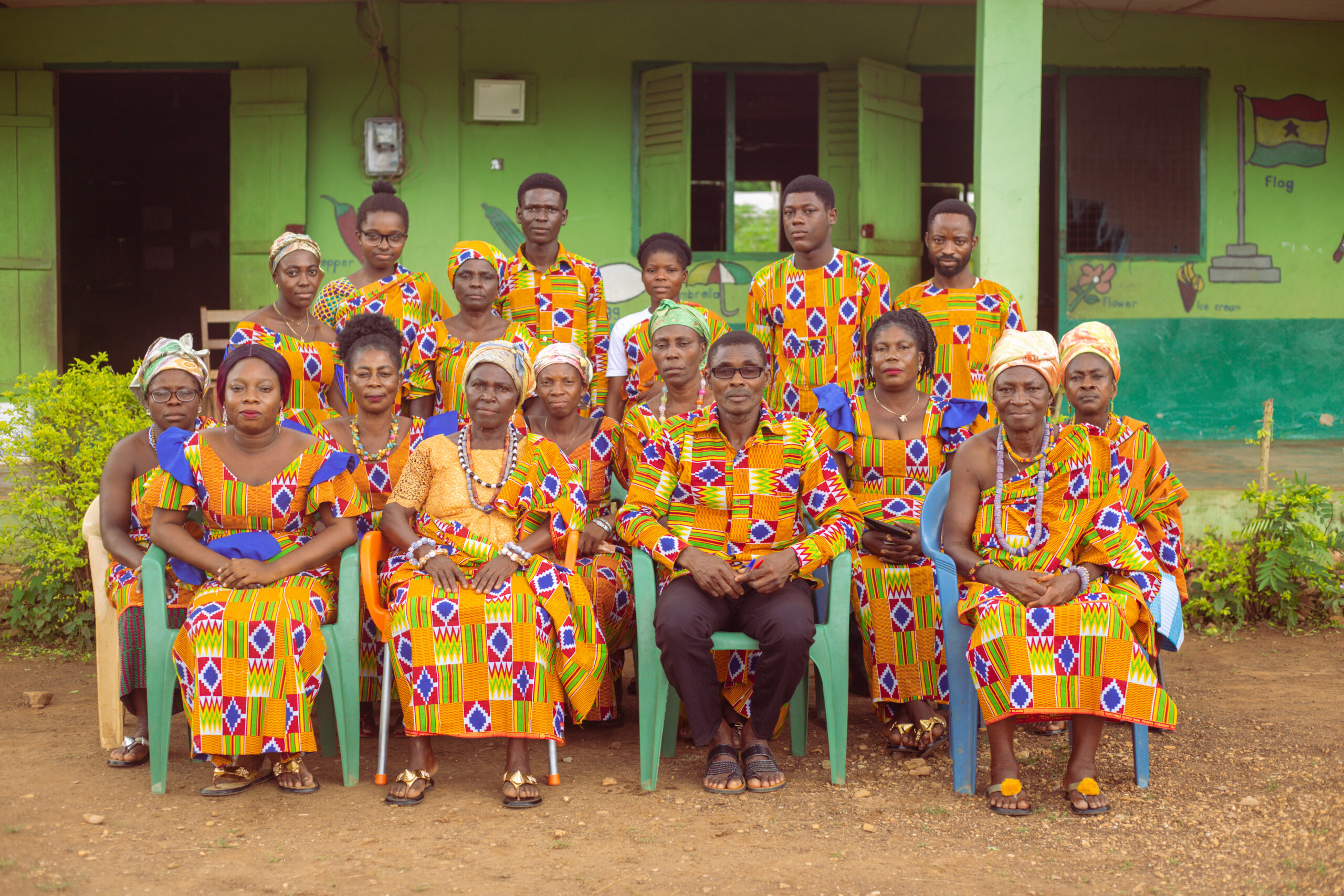 The teachers of Jack Academy sitting down and happy.